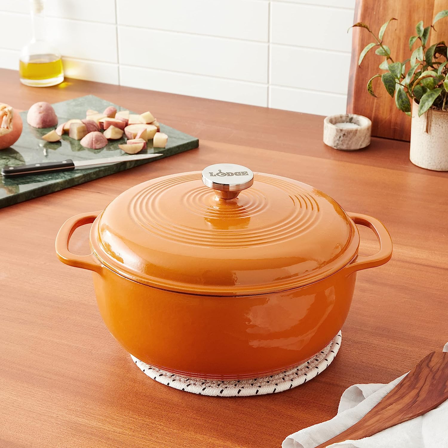 https://bigbigmart.com/wp-content/uploads/2023/07/Lodge-6-Quart-Enameled-Cast-Iron-Dutch-Oven-with-Lid-%E2%80%93-Dual-Handles-%E2%80%93-Oven-Safe-up-to-500%C2%B0-F-or-on-Stovetop-Use-to-Marinate-Cook-Bake-Refrigerate-and-Serve-%E2%80%93-Apricot4.jpg