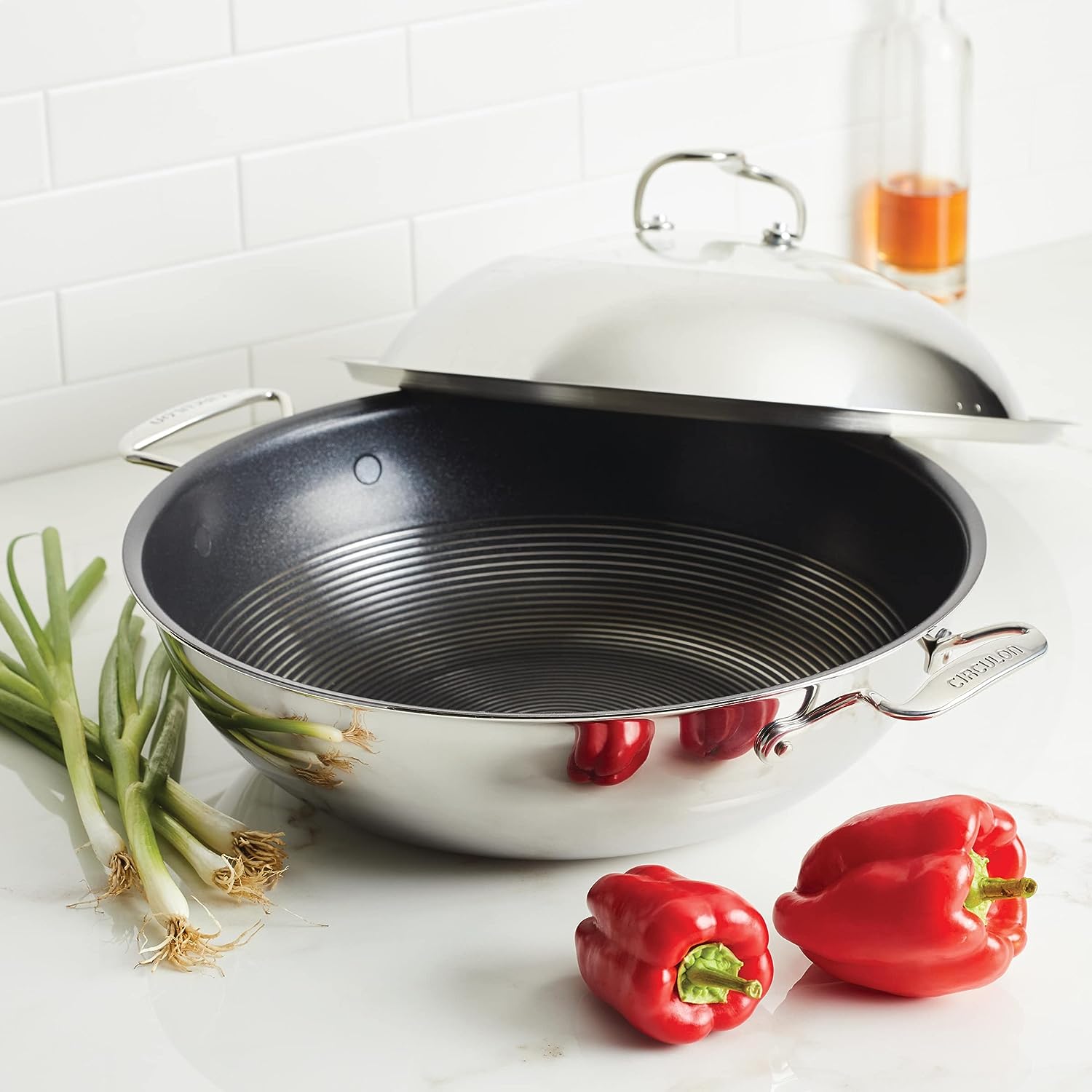 https://bigbigmart.com/wp-content/uploads/2023/09/Circulon-Clad-Stainless-Steel-Wok-Stir-Fry-with-Glass-Lid-and-Hybrid-SteelShield-and-Nonstick-Technology-14-Inch-Silver9.jpg